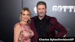FILE - In this June 14, 2018, file photo, Kelly Preston and John Travolta attend the premiere of "Gotti" at the SVA Theatre in New York. Preston, whose credits included the films “Twins” and “Jerry Maguire,” died Sunday, July 12, 2020, her husband…