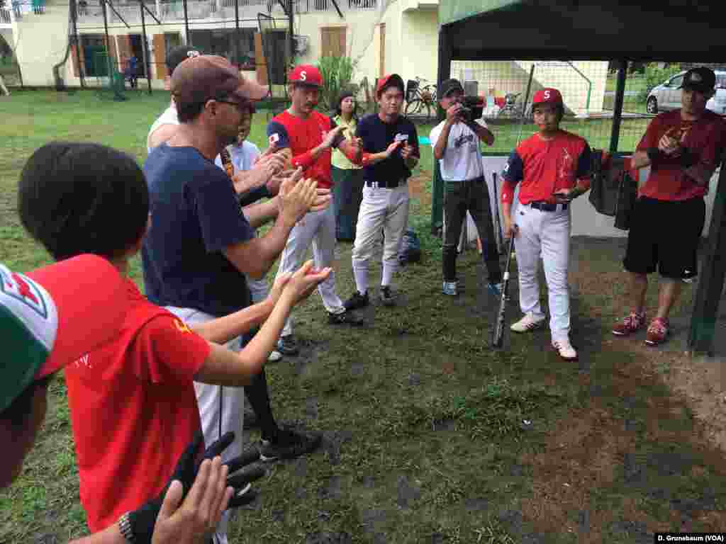 Expatriates from the U.S. and Japan get pumped up just before their games against the Myanmar national team.
