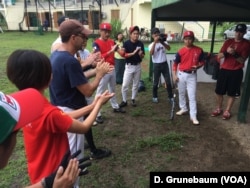 Expatriates from the U.S. and Japan get pumped up just before their games against the Myanmar national team.