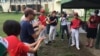 Expatriates from the U.S. and Japan get pumped up just before their games against the Myanmar national team.