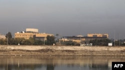 FILE - This Jan. 3, 2020, photo shows a general view of the US Embassy across the Tigris river in Iraq's capital, Baghdad.