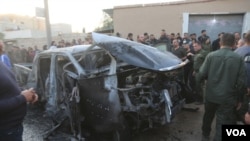 A vehicle that was reportedly targeted in a drone attack in Qamishli, Syria, Nov. 9, 2021. (Zana Omer/VOA)