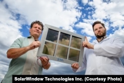 John Conklin (left) and Scott Hammond of SolarWindow Technologies Inc. with their transparent solar cell