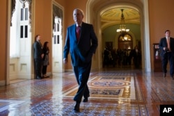 FILE - Senate Majority Leader Mitch McConnell of Ky. walks to his office on Capitol Hill in Washington.
