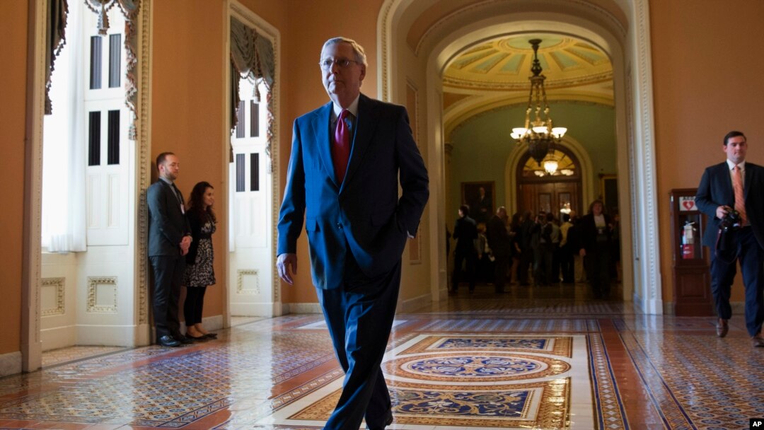 FILE - Senate Majority Leader Mitch McConnell of Ky. walks to his office on Capitol Hill in Washington.