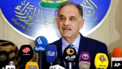 FILE - Saleh Mutlaq, who then was Iraq's deputy prime minister, speaks at a press conference in Baghdad, Dec. 17, 2014.