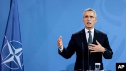 NATO Secretary General Jens Stoltenberg speaks during a news conference with German Chancellor Olaf Scholz after their talks at the Chancellery in Berlin, Germany, Jan. 18, 2022.