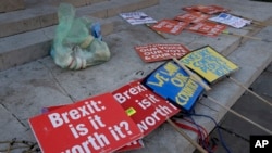 Brexit banners lie on the ground near parliament in London, Britain, Jan. 17, 2019.