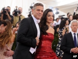 George Clooney and Amal Clooney arrive at The Metropolitan Museum of Art's Costume Institute benefit gala celebrating "China: Through the Looking Glass" on May 4, 2015, in New York.