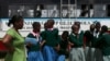 FILE - Students arrive at the start of a social event advocating against harmful practices such as female genital mutilation at the Imbirikani Girls High School in Imbirikani, Kenya, April 21, 2016. Now men are stepping up to end the practice of FGM.