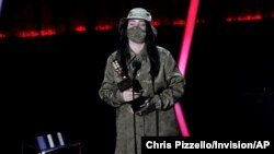 Billie Eilish accepts the award for top female artist at the Billboard Music Awards on Oct. 14, 2020, at the Dolby Theatre in Los Angeles.