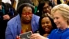 FILE - Democratic presidential candidate Hillary Clinton takes pictures with supporters after a campaign event at the Central Baptist Church in Columbia, South Carolina, Feb. 23, 2016.