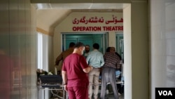 Medical staff prepared another patient for surgery — civilian casualties are rising, they say. (J. Dettmer/VOA)