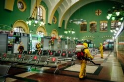 Servicemen of Russia's Emergencies Ministry wearing protective gear disinfect Moscow's Kazansky railway station, as the country adopts measures to curb the spread of the COVID-19.