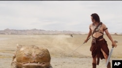 Taylor Kitsch as the title character in "John Carter," along with Woola, on Mars.
