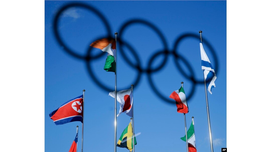 The North Korean flag, left, flies among flags from other nations at the Olympic Village at the 2018 Winter Olympics in Gangneung, South Korea, Feb. 1, 2018.
