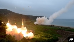 FILE - A photo provided by South Korea's Defense Ministry shows the country's Hyunmoo II Missile System fire a missile during a military exercise at an undisclosed location in South Korea, July 29, 2017.