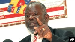 FILE - In this photo taken Feb. 17, 2010, Liberian Senator Prince Johnson gestures during an interview in Monrovia, Liberia. 