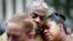 Mourners attend a vigil in Fountain Square where a shooting took place the previous day that claimed the lives of three civilians, Sept. 7, 2018, in Cincinnati. Suspect Omar Enrique Santa Perez entered the Fifth Third Center and began firing before being neutralized by police officers.