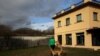FILE - Atila and Argi, trained therapeutic greyhounds used to treat patients with mental health issues and learning difficulties, try to get the attention of Ion Albiz, 38, at Benito Menni health facility in Elizondo, northern Spain, Feb. 13, 2017. 