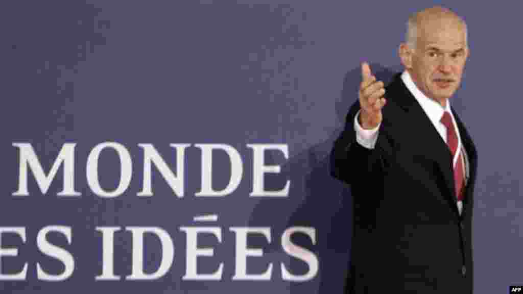 Greek Prime Minister George Papandreou arrives for a G20 summit in Cannes, France on Wednesday, Nov. 2, 2011. Papandreou was flying to the chic French Riviera resort of Cannes on Wednesday to explain himself to European leaders furious over his surprise r