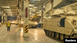 FILE PHOTO: Ukraine-bound Bradley Fighting Vehicles load onto ship in South Carolina