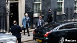 Britain's Prime Minister Theresa May leaves 10 Downing Street, as she faces a vote on her Brexit 'plan B', in London, Jan. 29, 2019. 