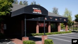 The Ruth's Chris Steak House is seen in Sacramento, Calif., April 21, 2020. The restaurant chain is among those businesses that qualified for the maximum $10 million in loans under the Paycheck Protection Program intended for small businesses.