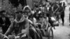 Cambodian women and children fill the back of a motorcycle taxi carrying them to safer parts of Phnom Penh as Khmer Rouge insurgents continue their artillery shelling of the capital, January, 28,1974. (AP Photo)