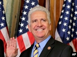 FILE - Rep. Jim Costa, D-Calif., poses for a re-creation of his swearing in on Capitol Hill in Washington as the 113th Congress began, Jan. 3, 2013. Costa faces Republican challenger Elizabeth Heng in the 2018 midterm elections.