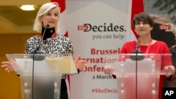 Dutch Minister for Trade and Development Cooperation Lilianne Plouman (right) and Danish Minister for Development and Cooperation Ulla Toernaes address a media conference, She Decides, at the Egmont Palace in Brussels, March 2, 2017. Nations are pledging