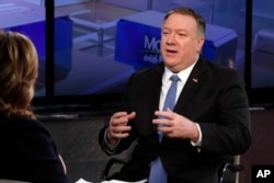 FILE - U.S. Secretary of State Mike Pompeo is interviewed by Maria Bartiromo during her "Mornings with Maria Bartiromo" program on the Fox Business Network, in New York, Feb. 21, 2019.