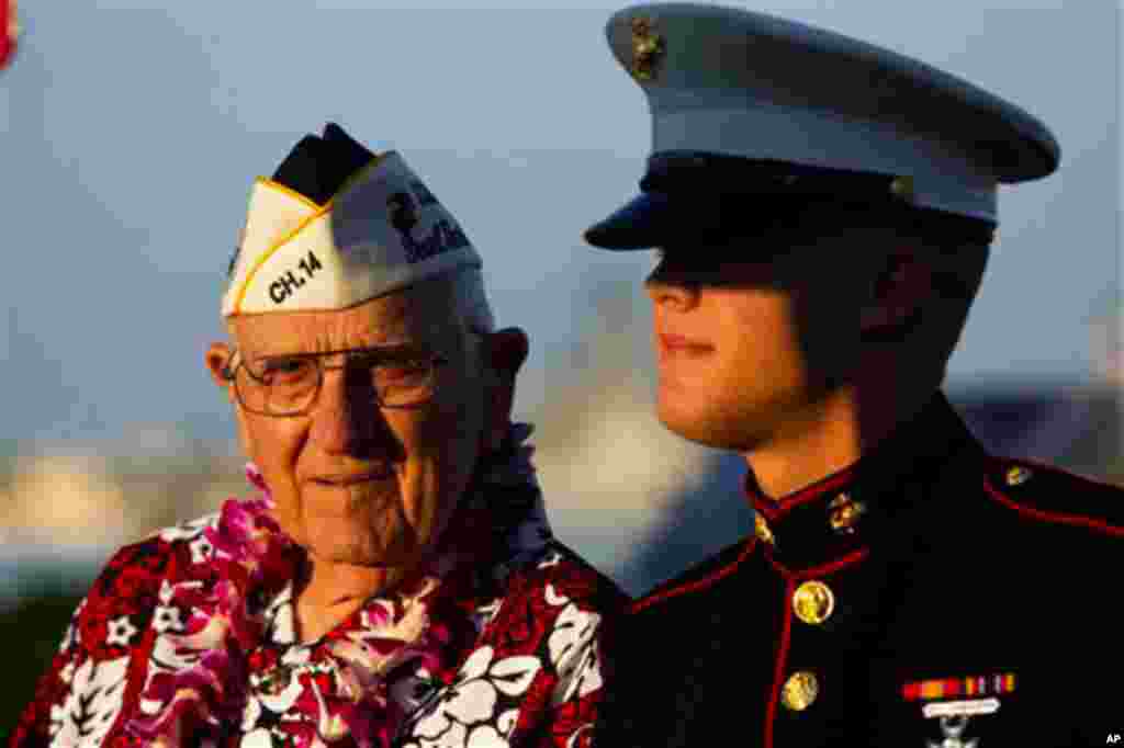 Pearl Harbor survivor John Hughes, left, and Lance Cpl. Zackary Morphew attend the 69th anniversary ceremony marking the attack on Pearl Harbor, Tuesday, Dec. 7 in Pearl Harbor, Hawaii. (Marco Garcia/AP)