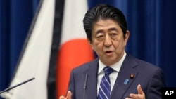 FILE - Japanese Prime Minister Shinzo Abe in Tokyo, March 10, 2016. 