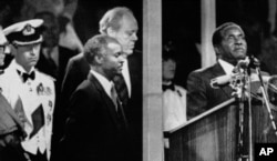 During the Independence celebrations, on April 18, 1980, Prime Minister Robert Mugabe takes the oath of allegiance to Zimbabwe in Highfields, Harare, Zimbabwe.