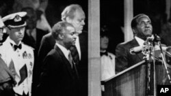 During the Independence celebrations, on April 18, 1980, Prime Minister Robert Mugabe takes the oath of allegiance to Zimbabwe in Highfields, Harare, Zimbabwe.