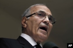 FILE - In this May 26, 2012 file photo, then Egyptian presidential candidate Ahmed Shafik speaks during a press conference at his office in Cairo, Egypt.
