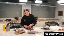 This undated photo shows Chef Sean Sherman, a winner of a 2019 James Beard Foundation Leadership Award, preparing apple blossoms. The award acknowledges Sherman's efforts to decolonize the Native American diet. 