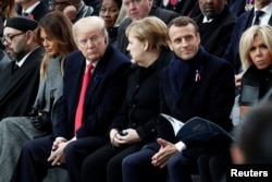 Brigitte Macron, French President Emmanuel Macron, German Chancellor Angela Merkel, U.S. President Donald Trump, first lady Melania Trump and Morocco's King Mohammed VI attend a commemoration ceremony for Armistice Day.