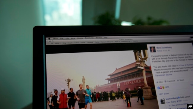A computer screen displays the social media posting by Mark Zuckerberg on Facebook in Beijing, China, Friday, March 18, 2016.