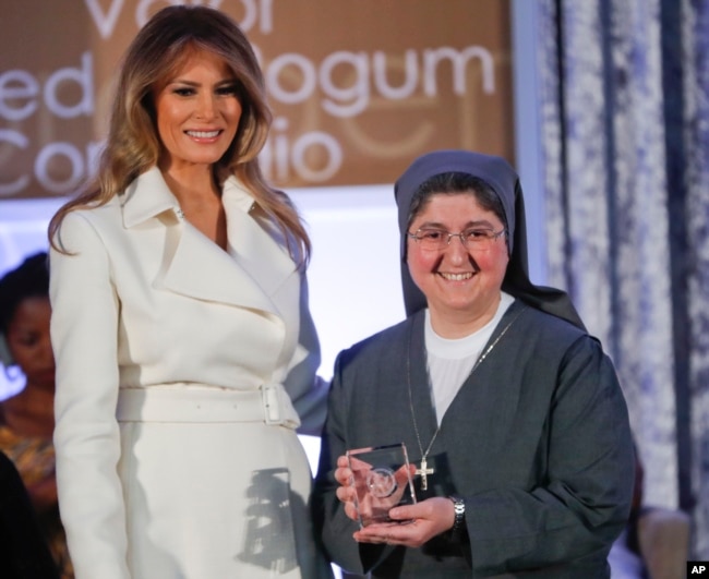 First lady Melania Trump presents the 2017 Secretary's of State's International Women of Courage (IWOC) Award to Sister Carolin Tahhan Fachakh from Syria, March 29, 2017, at the State Department in Washington.