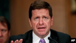 FILE - Securities and Exchange Commission Chairman Jay Clayton testifies before the Senate Banking Committee on Capitol Hill in Washington, Sept. 26, 2017.