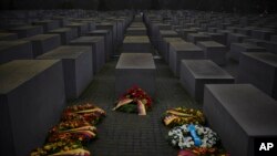 Wreaths placed at the Memorial to the Murdered Jews of Europe on the International Holocaust Remembrance Day in Berlin, Germany, Thursday, Jan. 27, 2022.