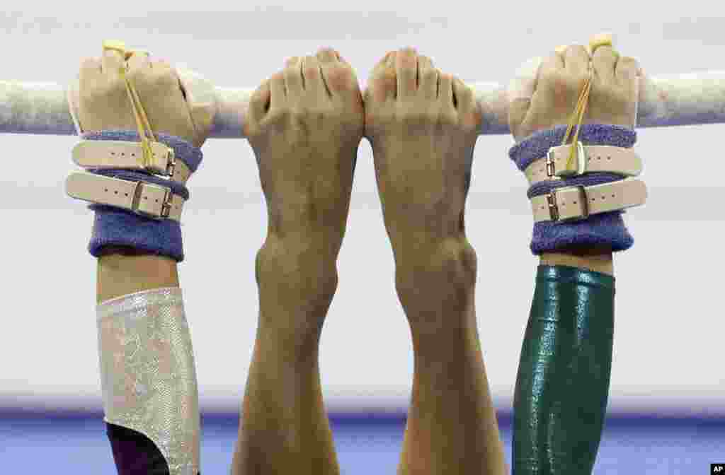 Vietnam's Ngoc Huong Do Thi performs on the uneven bars during the women's artistic gymnastics competition at the 30th South East Asian Games in Manila, Philippines.