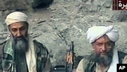 Osama bin Laden, left, and his top lieutenant, Egyptian Ayman al-Zawahri, right, are seen at an undisclosed location in this TV image broadcast, October 2001 (file photo)