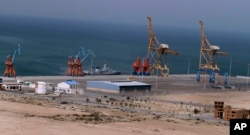 FILE - A Pakistan Navy ship berths at Gwadar port, Pakistan, April 11, 2016. The facility is seen as central to a multi-billion dollar economic cooperation agreement between Pakistan and China.