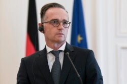 Menlu Jerman Heiko Maas dalam konferensi pers di Athena, Yunani, 25 Agustus 2020. (Photo by STR / Eurokinissi / AFP)