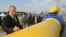 FILE - Vladimir Putin, who then was Russia's prime minister, autographs a natural gas pipeline in the Russian Far East city of Vladivostok during the pipeline's launch ceremony, Sept. 8, 2011. A contract allowing Russian gas to transit across Ukraine expired Dec. 31, 2024. 