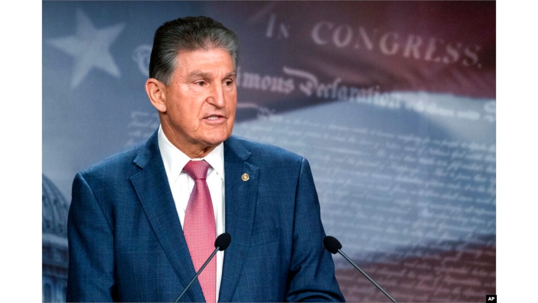 FILE - Sen. Joe Manchin, D-W.Va., speaks with reporters during a news conference on Capitol Hill, Nov. 1, 2021.