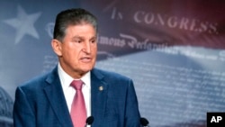 FILE - Democratic Senator Joe Manchin speaks with reporters during a news conference on Capitol Hill, in Washington, Nov. 1, 2021.